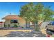 Charming single-story home featuring a spacious front yard with a mature tree providing shade at 4835 Nevada Ave, Las Vegas, NV 89104