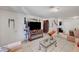 Living area with tile floors, sofas and a fireplace entertainment unit at 4835 Nevada Ave, Las Vegas, NV 89104
