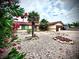 Charming single-story house featuring a low-maintenance desert landscape, palm trees, and a cozy curb appeal at 4881 E Imperial Ave, Las Vegas, NV 89104