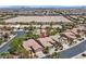 Aerial view of desert home surrounded by lush landscaping and a desert landscape at 5068 Rivedro St, Las Vegas, NV 89135