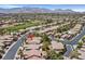 Overhead view of homes in a golf course community with mountain views in the background at 5068 Rivedro St, Las Vegas, NV 89135