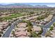 Aerial shot showcases a golf course and homes in a desirable suburban neighborhood at 5068 Rivedro St, Las Vegas, NV 89135