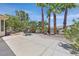 Expansive backyard with a large patio area, mature trees, and well-maintained landscaping at 5068 Rivedro St, Las Vegas, NV 89135