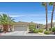 Charming single-story home with lush landscaping, a two-car garage, and a welcoming entrance at 5068 Rivedro St, Las Vegas, NV 89135