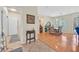 Welcoming foyer transitioning into a dining area with hardwood floors and natural light at 5068 Rivedro St, Las Vegas, NV 89135