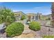 Charming single-story home with lush desert landscaping and stone walkway leading to the front gate at 5068 Rivedro St, Las Vegas, NV 89135