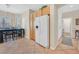 Eat-in kitchen with ceramic tile, white appliances and wood cabinets at 5068 Rivedro St, Las Vegas, NV 89135