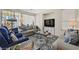 Inviting living room featuring comfortable seating, a stylish rug, and plenty of natural light at 5068 Rivedro St, Las Vegas, NV 89135