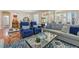 Cozy living area with hardwood floors, comfortable seating, and a decorative popcorn machine at 5068 Rivedro St, Las Vegas, NV 89135
