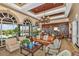 Comfortable living room with a wall of windows, lake views, and a built-in bookcase at 5068 Rivedro St, Las Vegas, NV 89135