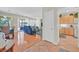 Open floorplan with hardwood floors connecting the dining area, living room, and kitchen at 5068 Rivedro St, Las Vegas, NV 89135