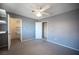 Bedroom with carpet, light gray walls, and a view of a walk-in closet at 5241 Janfred Ct # 18, Las Vegas, NV 89103