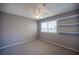 Bedroom featuring carpet floors, a ceiling fan and modern shelving at 5241 Janfred Ct # 18, Las Vegas, NV 89103