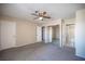Bedroom features carpet floors, a ceiling fan, and access to the ensuite bathroom at 5241 Janfred Ct # 18, Las Vegas, NV 89103