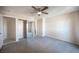 Spacious bedroom features a ceiling fan, neutral walls, and a mirrored closet at 5241 Janfred Ct # 18, Las Vegas, NV 89103