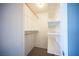 Walk-in closet with shelving and hanging rods at 5241 Janfred Ct # 18, Las Vegas, NV 89103
