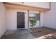 Welcoming front entrance with security door and a small landscaped area at 5241 Janfred Ct # 18, Las Vegas, NV 89103