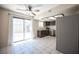Kitchen and dining area, with dark brown cabinetry, stainless steel appliances, and outdoor access at 5241 Janfred Ct # 18, Las Vegas, NV 89103