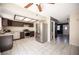 Well-equipped kitchen with stainless steel appliances, brown cabinets, and granite countertops at 5241 Janfred Ct # 18, Las Vegas, NV 89103
