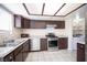Functional kitchen featuring a stainless steel gas range and granite countertops at 5241 Janfred Ct # 18, Las Vegas, NV 89103