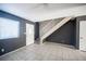 Bright living space with tile flooring and a staircase leading to the upper level at 5241 Janfred Ct # 18, Las Vegas, NV 89103