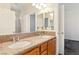 Bathroom vanity with double sinks and granite countertops, offering ample space and style at 5380 Flowing Spring St, Las Vegas, NV 89122