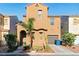 Charming two-story home with a landscaped front yard, driveway, and attached garage at 5380 Flowing Spring St, Las Vegas, NV 89122