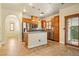 Spacious kitchen with stainless steel appliances, granite countertops, island, and light wood cabinets at 5380 Flowing Spring St, Las Vegas, NV 89122