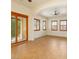 Open living room featuring tile floors, multiple shuttered windows, and a ceiling fan at 5380 Flowing Spring St, Las Vegas, NV 89122