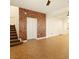 Spacious living room featuring tile floors, decorative wood accent wall, and an open floor plan at 5380 Flowing Spring St, Las Vegas, NV 89122