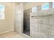 Contemporary shower with unique tile work, dual shower heads, and natural light at 5380 Flowing Spring St, Las Vegas, NV 89122