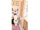 Cozy bathroom with tulip décor, white toilet and natural wood cabinets at 5415 W Harmon Ave # 2094, Las Vegas, NV 89103
