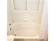 Bright bathtub showcasing the clean, white tile and fixtures, and a window providing natural light at 5415 W Harmon Ave # 2094, Las Vegas, NV 89103