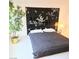 Bedroom featuring a full bed and a striking headboard, complemented by a decorative plant at 5415 W Harmon Ave # 2094, Las Vegas, NV 89103