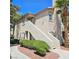 Charming two-story condo with stucco siding, a tile roof, and well-manicured landscaping at 5415 W Harmon Ave # 2094, Las Vegas, NV 89103