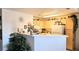 Bright kitchen with white appliances, breakfast bar, and ample counter space at 5415 W Harmon Ave # 2094, Las Vegas, NV 89103