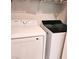 Laundry room with Samsung washer and dryer and white wire shelving at 5415 W Harmon Ave # 2094, Las Vegas, NV 89103