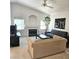 Bright living room featuring high vaulted ceilings, fireplace, and a cozy seating arrangement at 5415 W Harmon Ave # 2094, Las Vegas, NV 89103