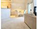 Open-concept space featuring a dining area and living room with neutral carpet at 5415 W Harmon Ave # 2094, Las Vegas, NV 89103