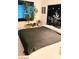 Main bedroom with queen bed, accent wall hanging, and lots of light at 5415 W Harmon Ave # 2094, Las Vegas, NV 89103