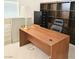 Home office featuring a large wooden desk, and a built-in bookcase for storage and organization at 5415 W Harmon Ave # 2094, Las Vegas, NV 89103