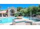 Community pool with elegant architectural features and inviting seating areas at 5415 W Harmon Ave # 2094, Las Vegas, NV 89103