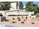 Opulence Condos community sign with manicured landscaping and attractive desert rock at 5415 W Harmon Ave # 2094, Las Vegas, NV 89103