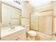 Bathroom features a single sink vanity and shower over tub with sliding glass doors at 5536 Cleary Ct, Las Vegas, NV 89108