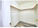 Spacious walk-in closet features new wood-look flooring and shelving perfect for storage at 5536 Cleary Ct, Las Vegas, NV 89108