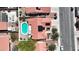 Aerial shot showcases home with solar panels, a refreshing blue pool, covered patio and desert landscaping at 608 Blooming View Ave, North Las Vegas, NV 89032
