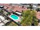 Aerial view showcases the backyard with sparkling pool and mature landscaping at 608 Blooming View Ave, North Las Vegas, NV 89032