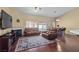 Spacious living room featuring a fireplace, hardwood floors, and access to the pool at 608 Blooming View Ave, North Las Vegas, NV 89032