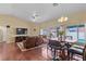 Living and dining area featuring beautiful hardwood floors and neutral décor at 608 Blooming View Ave, North Las Vegas, NV 89032