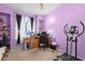 Well-organized office space with desk, shelving, and fitness equipment at 608 Blooming View Ave, North Las Vegas, NV 89032